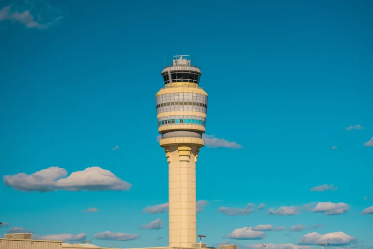 An ATC tower stands out above the clouds.