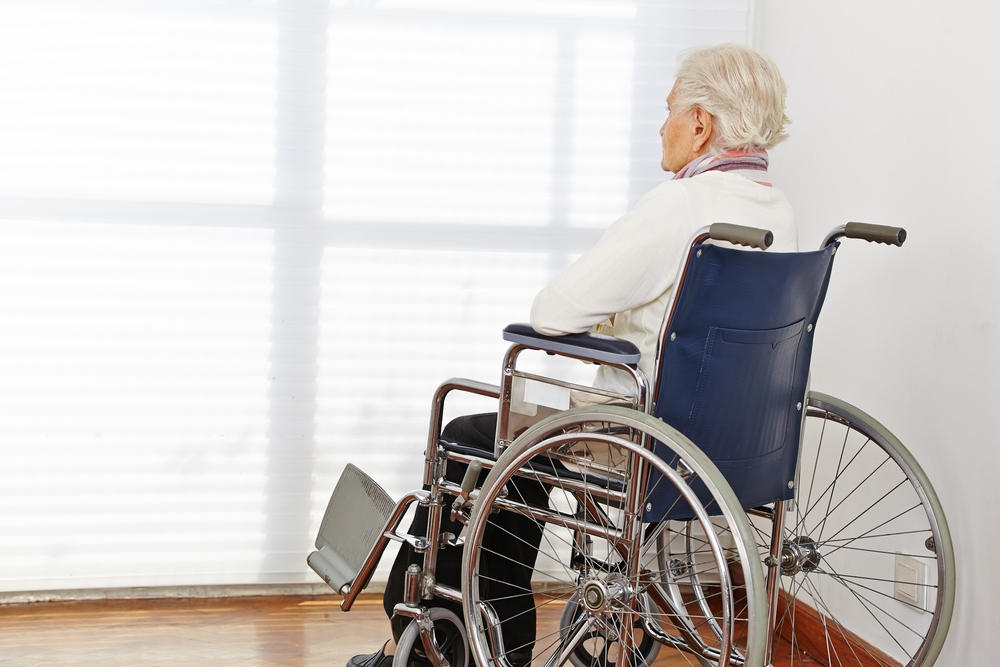 Atlanta nursing home resident sitting alone in wheelchair showing signs of neglect