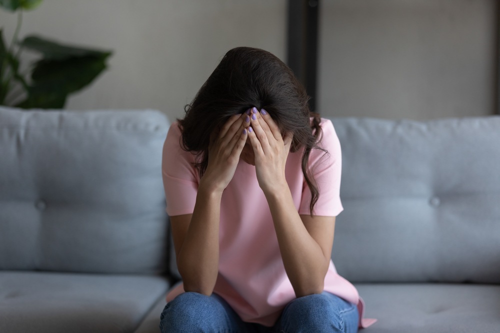Woman grieving the loss of a loved one in a Warner Robins wrongful death case