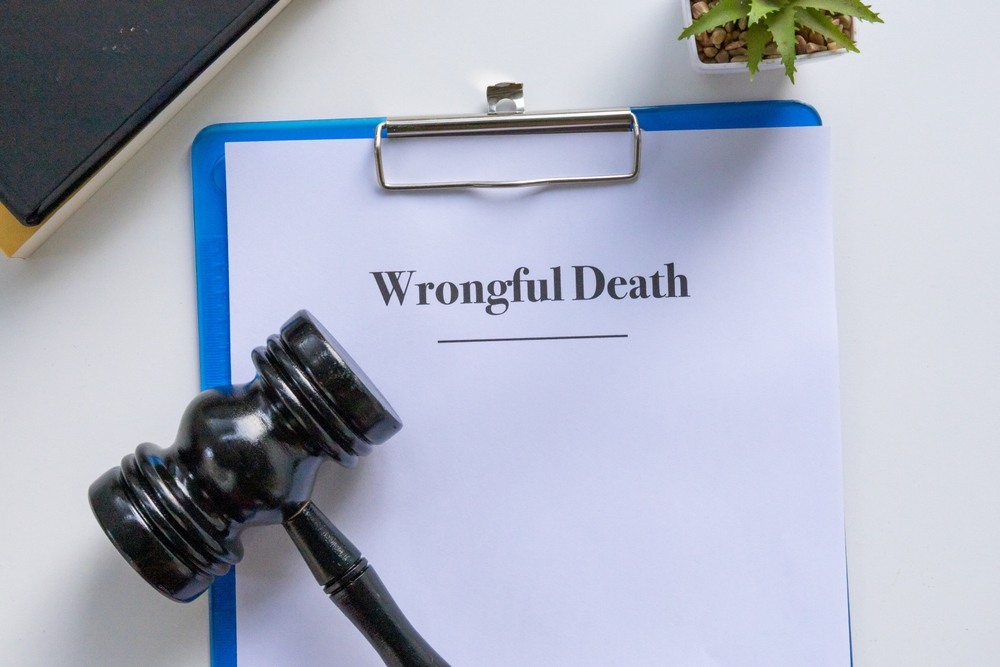 Wrongful death claim paperwork with gavel representing Georgia damages law
