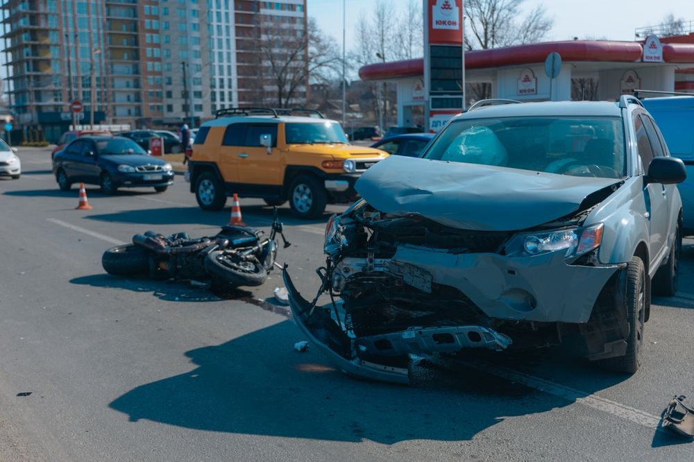 Wrecked SUV with major front-end damage at the scene of a serious Georgia car accident