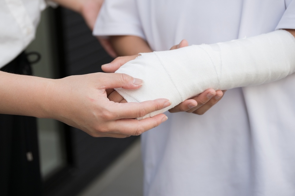 Close-up of a bandaged arm representing a physical injury in a Georgia personal injury case