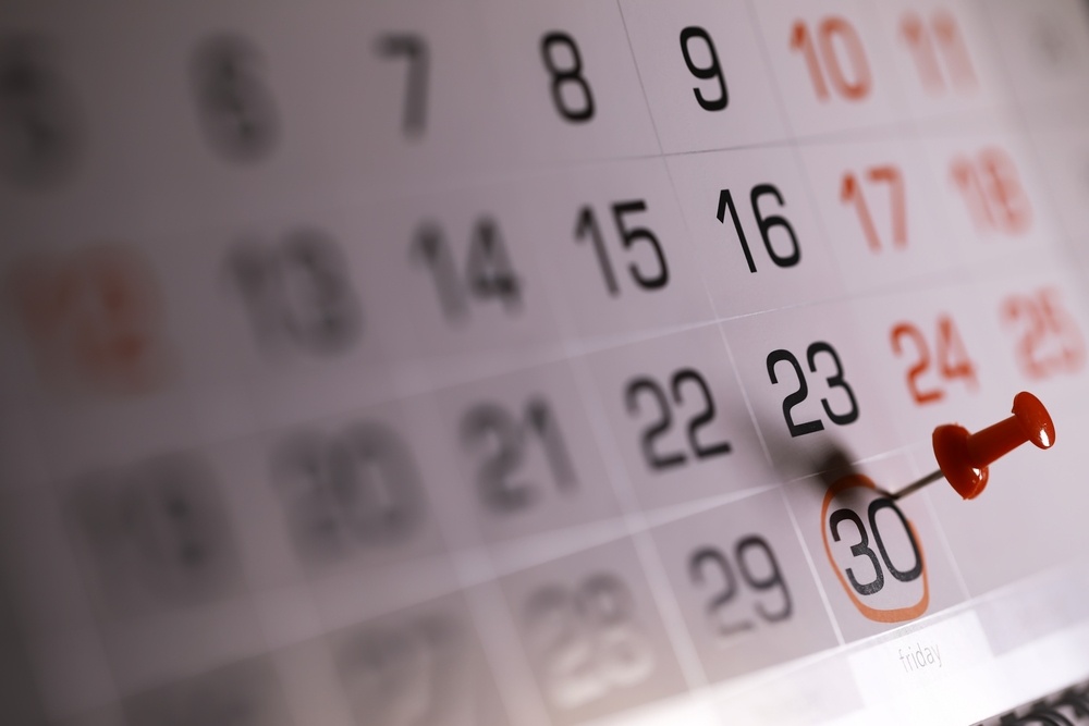 Calendar page with the 30th circled in red and marked with a red push pin