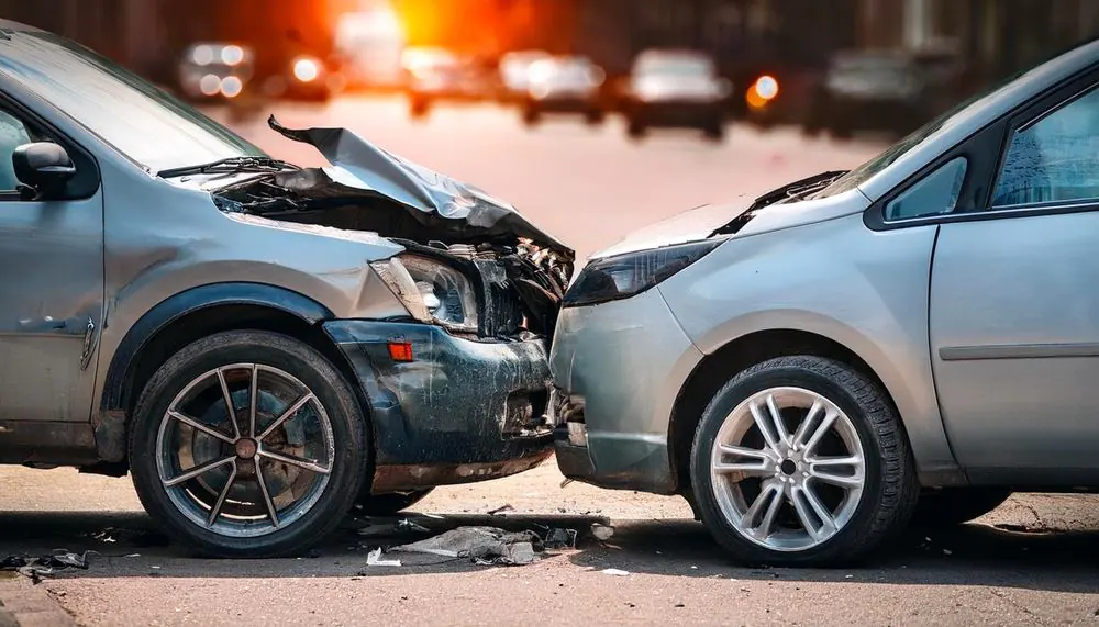 Two vehicles with severe front-end damage after a Georgia car crash